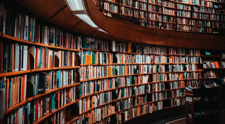 photo of brown wooden bookshelf